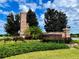 Stonebridge entrance with stone pillars, manicured landscaping, and signage at 6770 Pebblebrooke Way, Zephyrhills, FL 33541