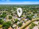 Aerial view of a neighborhood highlighting lush greenery, residential streets, and a sense of community at 7230 17Th N Ln, St Petersburg, FL 33702