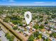 An aerial view of a home in a quiet neighborhood near a waterway, with lush greenery at 7230 17Th N Ln, St Petersburg, FL 33702