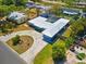 Aerial view of the property with a circular driveway, enclosed pool area and beautiful landscaping at 7230 17Th N Ln, St Petersburg, FL 33702
