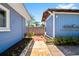 The backyard features a brick pathway and mature landscaping at 7230 17Th N Ln, St Petersburg, FL 33702