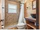 Unique bathroom with stone shower and wooden walls at 7230 17Th N Ln, St Petersburg, FL 33702