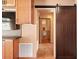 View of rustic style bathroom with a urinal and brown tiled flooring and walls at 7230 17Th N Ln, St Petersburg, FL 33702