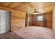 Unique bedroom with a wood paneled ceiling and walls and a white door at 7230 17Th N Ln, St Petersburg, FL 33702