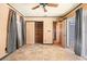 Bedroom featuring tile flooring, closet, and sliding glass door to backyard at 7230 17Th N Ln, St Petersburg, FL 33702