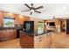 Kitchen features an island, stainless appliances, and modern tile backsplash with views to the pool at 7230 17Th N Ln, St Petersburg, FL 33702