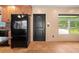 Spacious kitchen with black refrigerator and backsplash, wood cabinets, and a window with natural lighting at 7230 17Th N Ln, St Petersburg, FL 33702