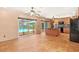 Open kitchen and dining area features an island and black appliances with views of the pool at 7230 17Th N Ln, St Petersburg, FL 33702