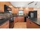 Kitchen features granite countertops, wood cabinetry, stainless appliances, and modern tile backsplash at 7230 17Th N Ln, St Petersburg, FL 33702