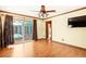 Living room with wood floors and sliding glass doors to the outdoor pool and patio area at 7230 17Th N Ln, St Petersburg, FL 33702