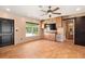 Open living room featuring a ceiling fan, tile floors, built-in cabinets, and a view of the neighborhood at 7230 17Th N Ln, St Petersburg, FL 33702