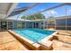 Beautiful backyard pool with an enclosed screened patio for outdoor enjoyment at 7230 17Th N Ln, St Petersburg, FL 33702
