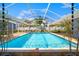 The in-ground swimming pool is surrounded by an enclosed screened patio for outdoor enjoyment at 7230 17Th N Ln, St Petersburg, FL 33702