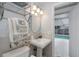 Bathroom boasting pool access, modern vanity, updated fixtures, and tile flooring at 7341 Bimini Dr, Port Richey, FL 34668