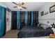 Bedroom featuring a dark-toned comforter, ceiling fan, and natural light at 7341 Bimini Dr, Port Richey, FL 34668