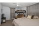 Bedroom features bunk beds, neutral walls, and a comfortable queen bed at 7341 Bimini Dr, Port Richey, FL 34668