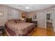 Bedroom featuring tile floors, a queen bed with patterned bedding, and neutral walls at 7341 Bimini Dr, Port Richey, FL 34668