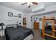 Bedroom featuring a dark-toned comforter, ceiling fan, and dresser at 7341 Bimini Dr, Port Richey, FL 34668