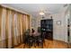 Cozy dining room with hardwood floors, modern light fixture, and decorative accents at 7341 Bimini Dr, Port Richey, FL 34668
