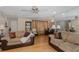 Open-concept living room featuring hardwood floors, plush sofas, and natural light, ideal for entertaining or relaxing at 7341 Bimini Dr, Port Richey, FL 34668
