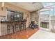 Outdoor patio with a tiki bar and seating at 7341 Bimini Dr, Port Richey, FL 34668