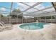 Screened-in pool with a patio, perfect for entertaining at 7341 Bimini Dr, Port Richey, FL 34668