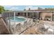 A screened-in pool area offering privacy, ample seating, and an outdoor grill at 7341 Bimini Dr, Port Richey, FL 34668