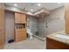 Bathroom boasts a frameless glass shower, tile walls, and modern fixtures at 8211 Brent St # 837, Port Richey, FL 34668