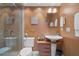 A well-lit bathroom with a glass-enclosed shower and a pedestal sink with drawers for storage at 8211 Brent St # 837, Port Richey, FL 34668