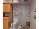 Tiled bathroom with glass shower, built in cabinets, and modern toilet at 8211 Brent St # 837, Port Richey, FL 34668