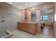 Bathroom featuring double vanity, granite countertops, and a tiled shower at 8211 Brent St # 837, Port Richey, FL 34668