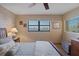 Bright bedroom featuring water view from the window and decorative wood paneling at 8211 Brent St # 837, Port Richey, FL 34668