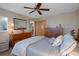 Well-furnished bedroom with wooden accents, featuring ample storage space and comfortable decor at 8211 Brent St # 837, Port Richey, FL 34668