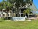 Exterior view of the Sand Pebble Pointe community sign surrounded by manicured landscaping at 8211 Brent St # 837, Port Richey, FL 34668