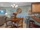 Comfortable dining area with table set for four, located near kitchen and living spaces at 8211 Brent St # 837, Port Richey, FL 34668