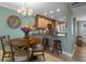 Inviting dining area with a wooden table, bar seating, and easy access to the kitchen at 8211 Brent St # 837, Port Richey, FL 34668