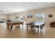 This game room features a pool table and table tennis making it the perfect place to have fun with friends at 8211 Brent St # 837, Port Richey, FL 34668