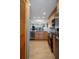 Bright kitchen showcasing stainless steel appliances, wood cabinets, and an open layout to the living space at 8211 Brent St # 837, Port Richey, FL 34668