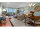 Cozy living and dining area with neutral furniture, water views, and natural light at 8211 Brent St # 837, Port Richey, FL 34668