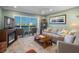 Well-appointed living room featuring a fireplace, comfortable seating, and views of the water at 8211 Brent St # 837, Port Richey, FL 34668