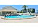 Enjoy the community pool, with its clean blue water and multiple seating options in a cabana at 8211 Brent St # 837, Port Richey, FL 34668