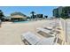 Relax by the pool, with its ample seating and beautiful tropical landscaping overlooking a water view at 8211 Brent St # 837, Port Richey, FL 34668