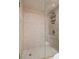 Shower with decorative stone and tile, a glass enclosure, and multiple showerheads at 8211 Brent St # 837, Port Richey, FL 34668