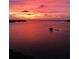 Beautiful sunset view over the water, with colorful sky reflecting on the calm surface at 8211 Brent St # 837, Port Richey, FL 34668