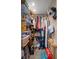 Walk-in closet with shelving units and hanging rods featuring a variety of storage options at 8211 Brent St # 837, Port Richey, FL 34668