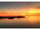 Scenic water view featuring a colorful sunset and calm water surface with islands in the distance at 8211 Brent St # 837, Port Richey, FL 34668