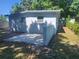 Home's backyard with a patio area at 825 Lincoln Ave, Tarpon Springs, FL 34689