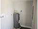 Basement features a hot water tank, and laundry hookups at 825 Lincoln Ave, Tarpon Springs, FL 34689