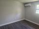 Cozy bedroom with mini-split AC unit and hardwood-style flooring at 825 Lincoln Ave, Tarpon Springs, FL 34689