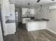 Stylish kitchen with island, sleek countertops, stainless steel appliances, and modern lighting at 825 Lincoln Ave, Tarpon Springs, FL 34689